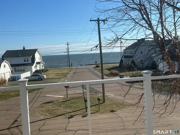 a view of house with a yard