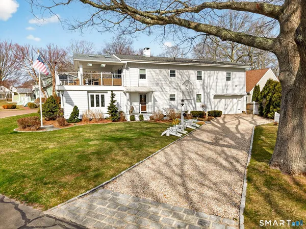 a view of a swimming pool with lounge chairs