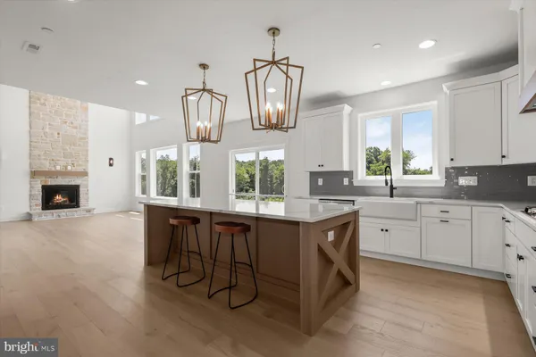 a kitchen with a sink cabinets and window