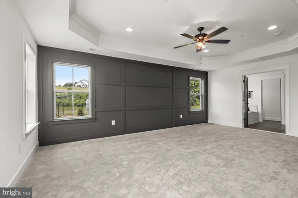 a bathroom with a double vanity sink mirror and shower