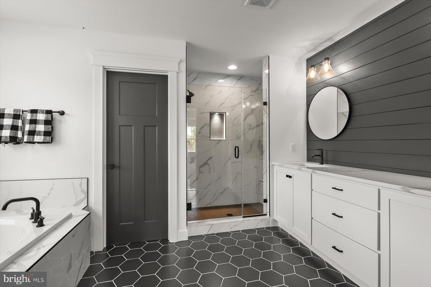 2 Snydersburg Road Westminster, MD 21157 - Photo 23 of 33 a bathroom with a double vanity sink mirror and shower