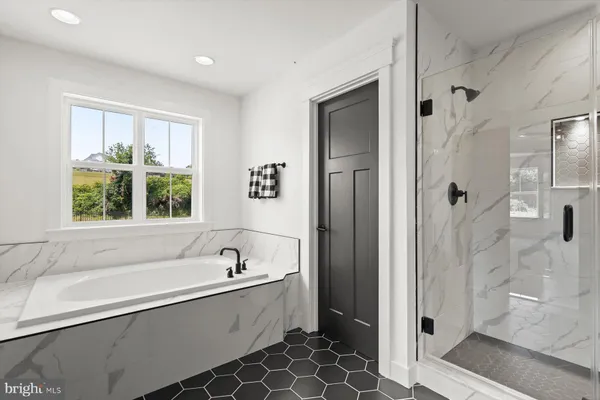 a bathroom with a double vanity sink and mirror