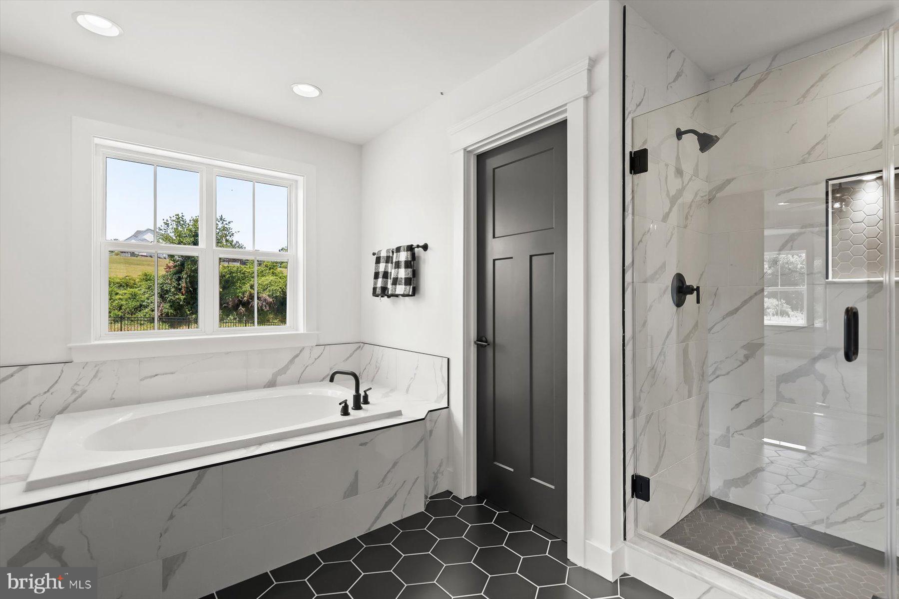 2 Snydersburg Road Westminster, MD 21157 - Photo 24 of 33 a spacious bathroom with a bathtub and a shower