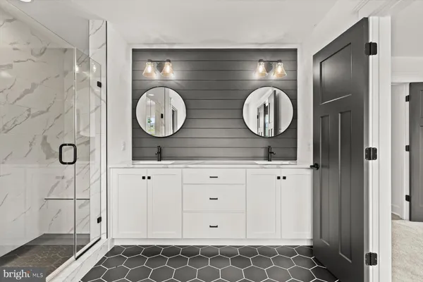 a bathroom with a toilet sink and shower