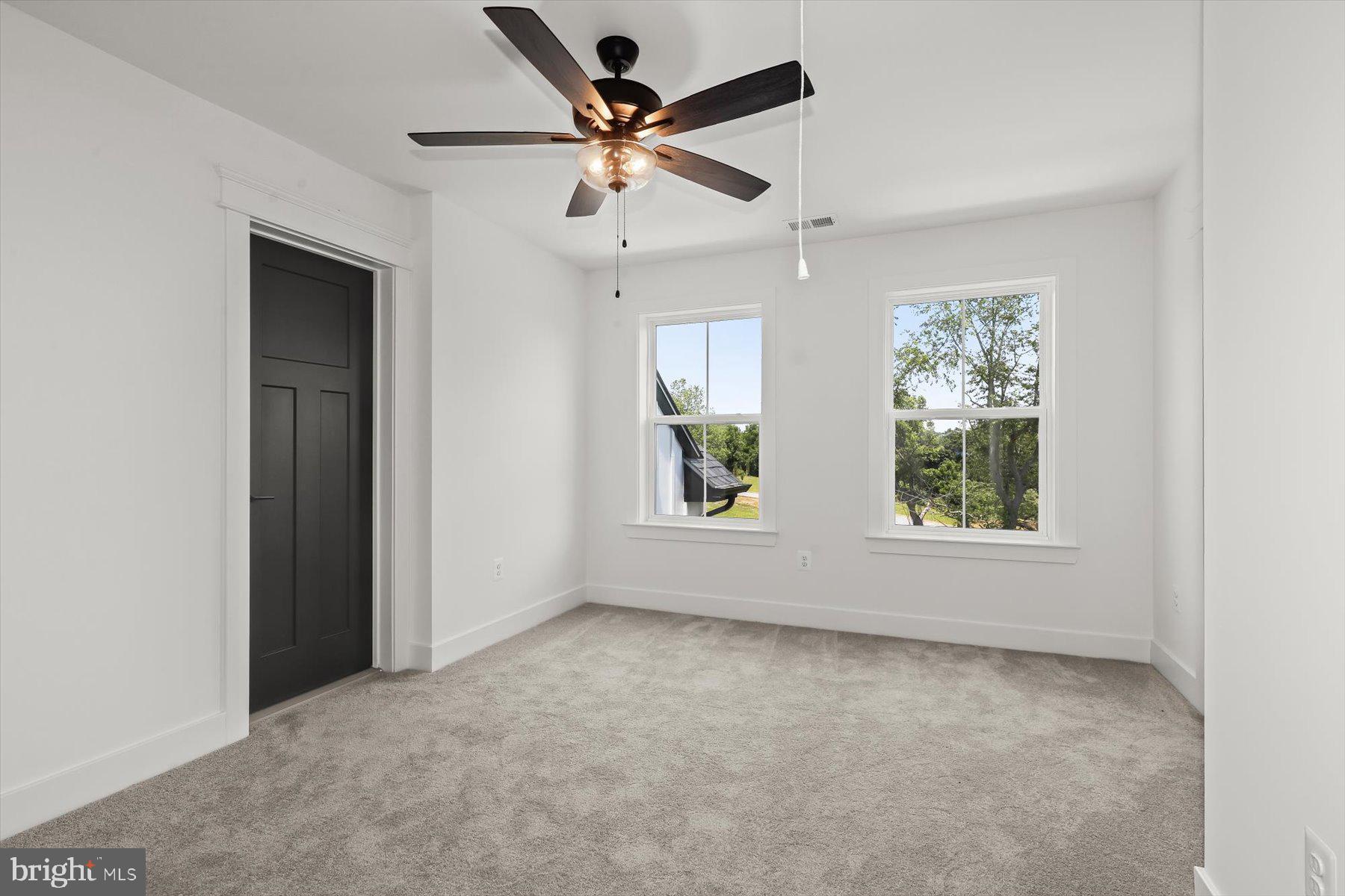 2 Snydersburg Road Westminster, MD 21157 - Photo 27 of 33 an empty room with windows and ceiling fan