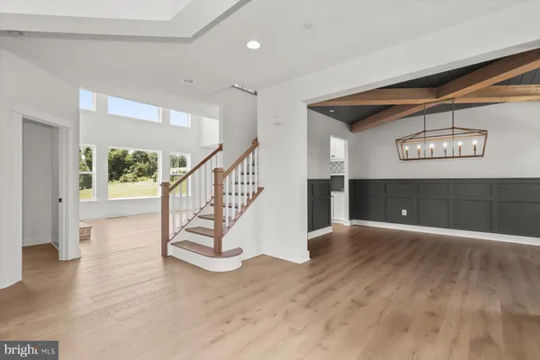 a view of an entryway with wooden floor