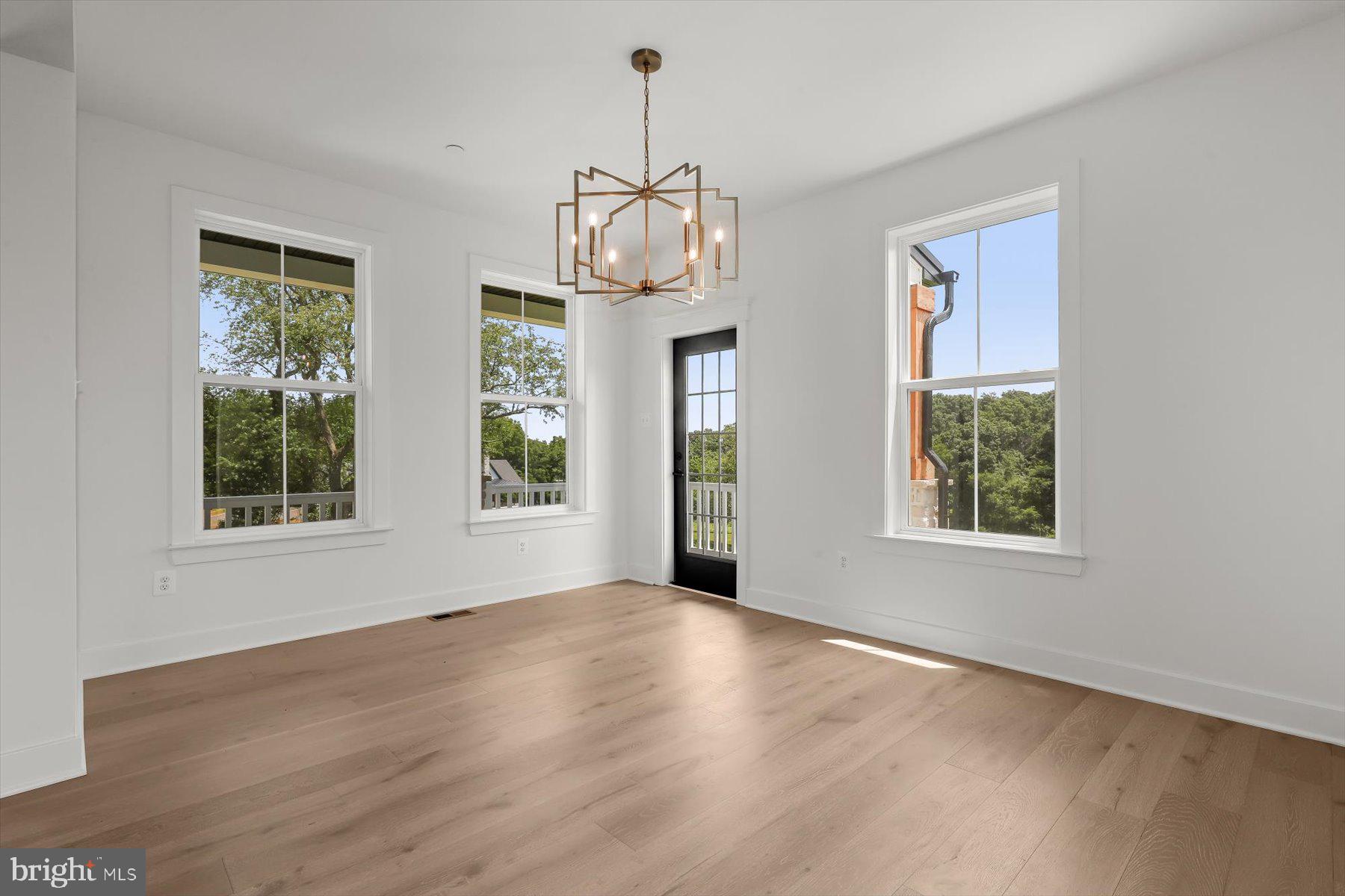 2 Snydersburg Road Westminster, MD 21157 - Photo 5 of 33 a view of an empty room with wooden floor and a window