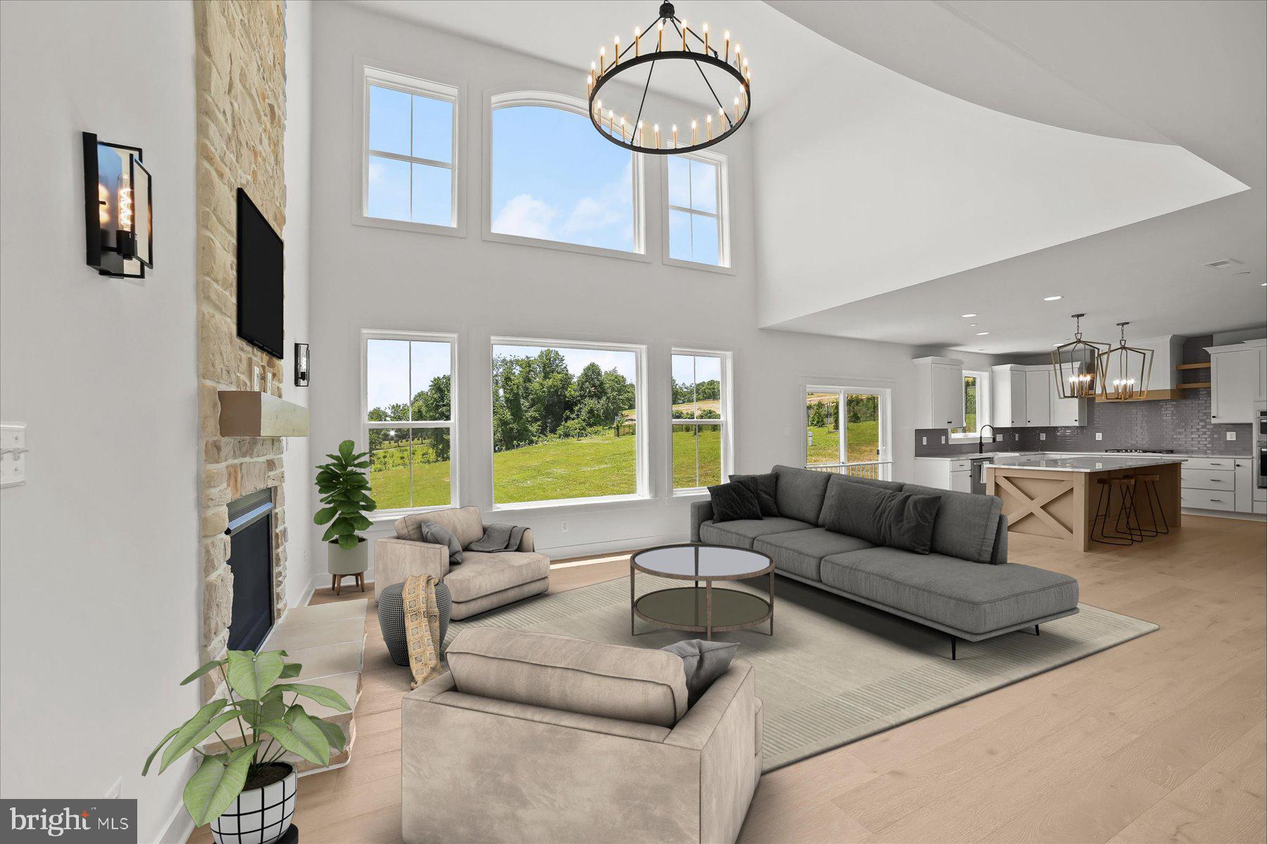 2 Snydersburg Road Westminster, MD 21157 - Photo 9 of 33 a living room with furniture a fireplace and a large window