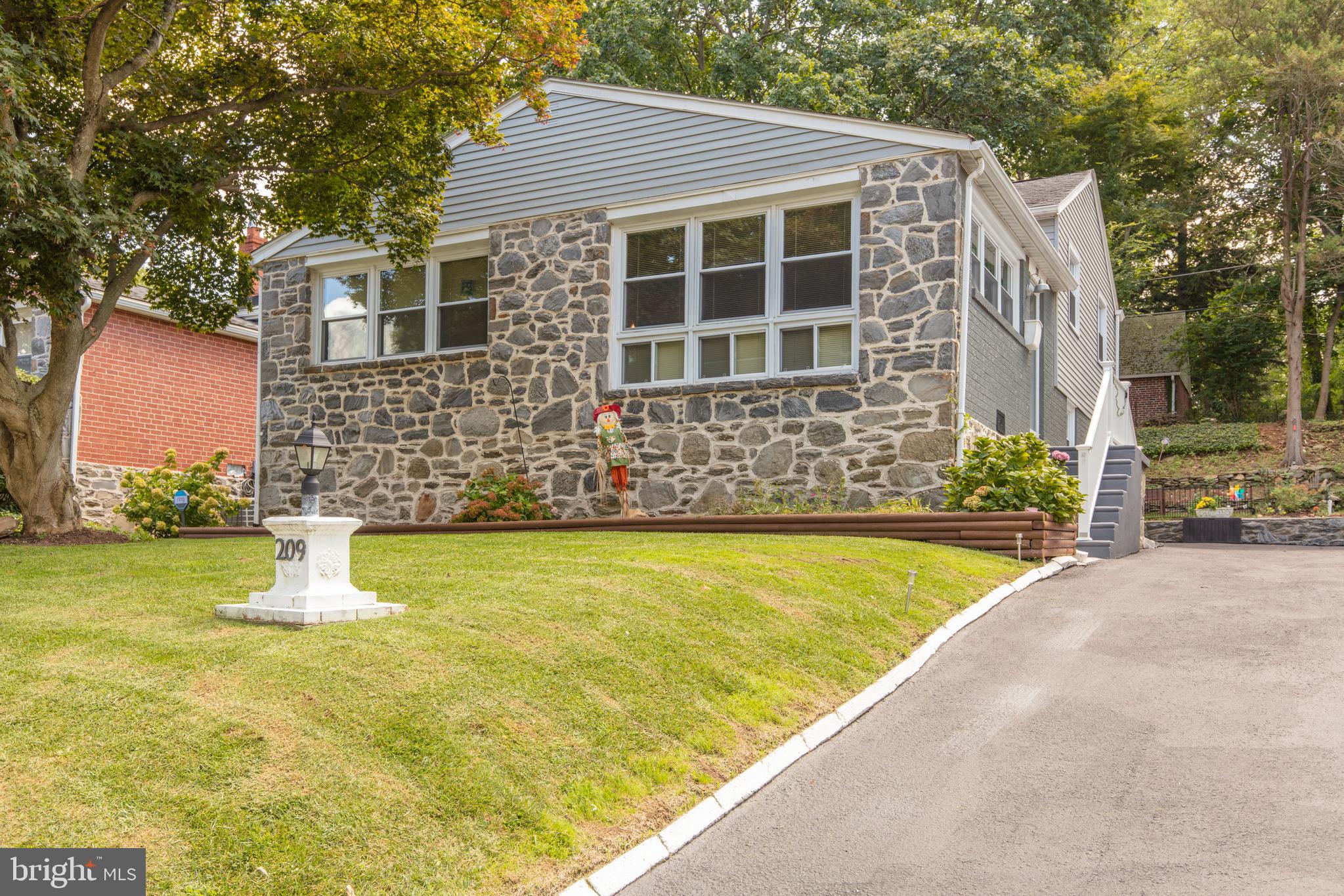 209 Glendale Road Havertown, PA 19083 - Photo 1 of 38 a front view of a house with a yard