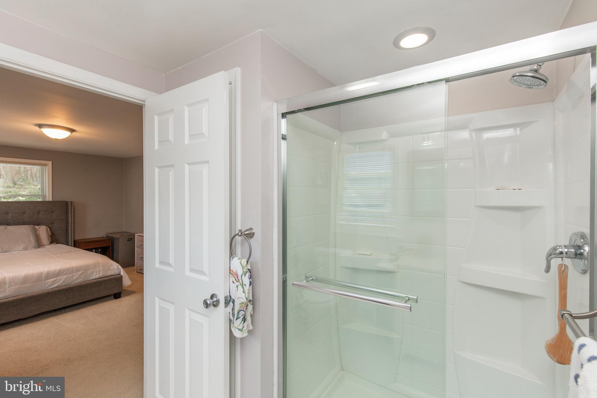 209 Glendale Road Havertown, PA 19083 - Photo 17 of 38 a bathroom with a glass shower door