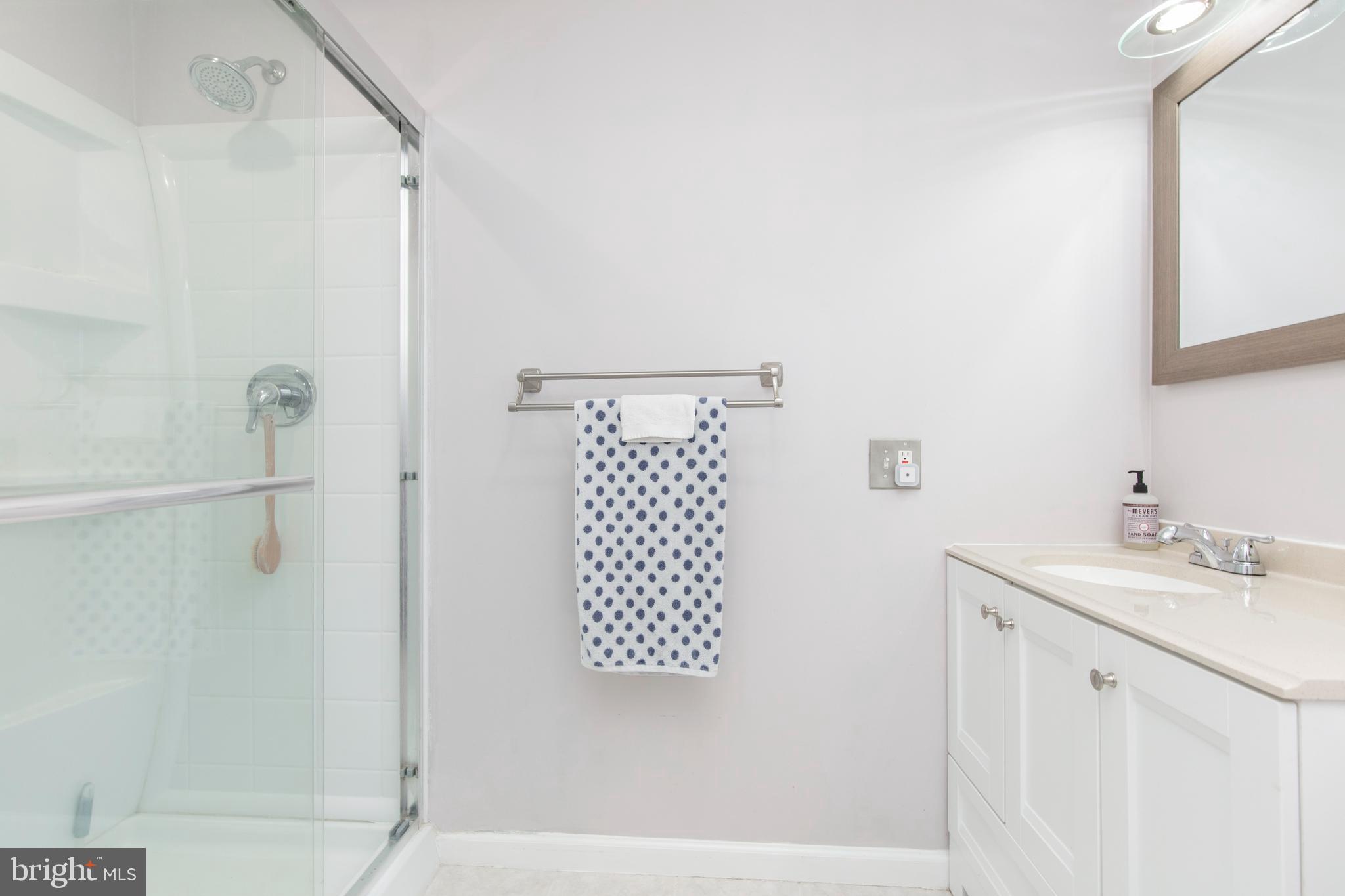 209 Glendale Road Havertown, PA 19083 - Photo 18 of 38 a bathroom with a sink and a mirror