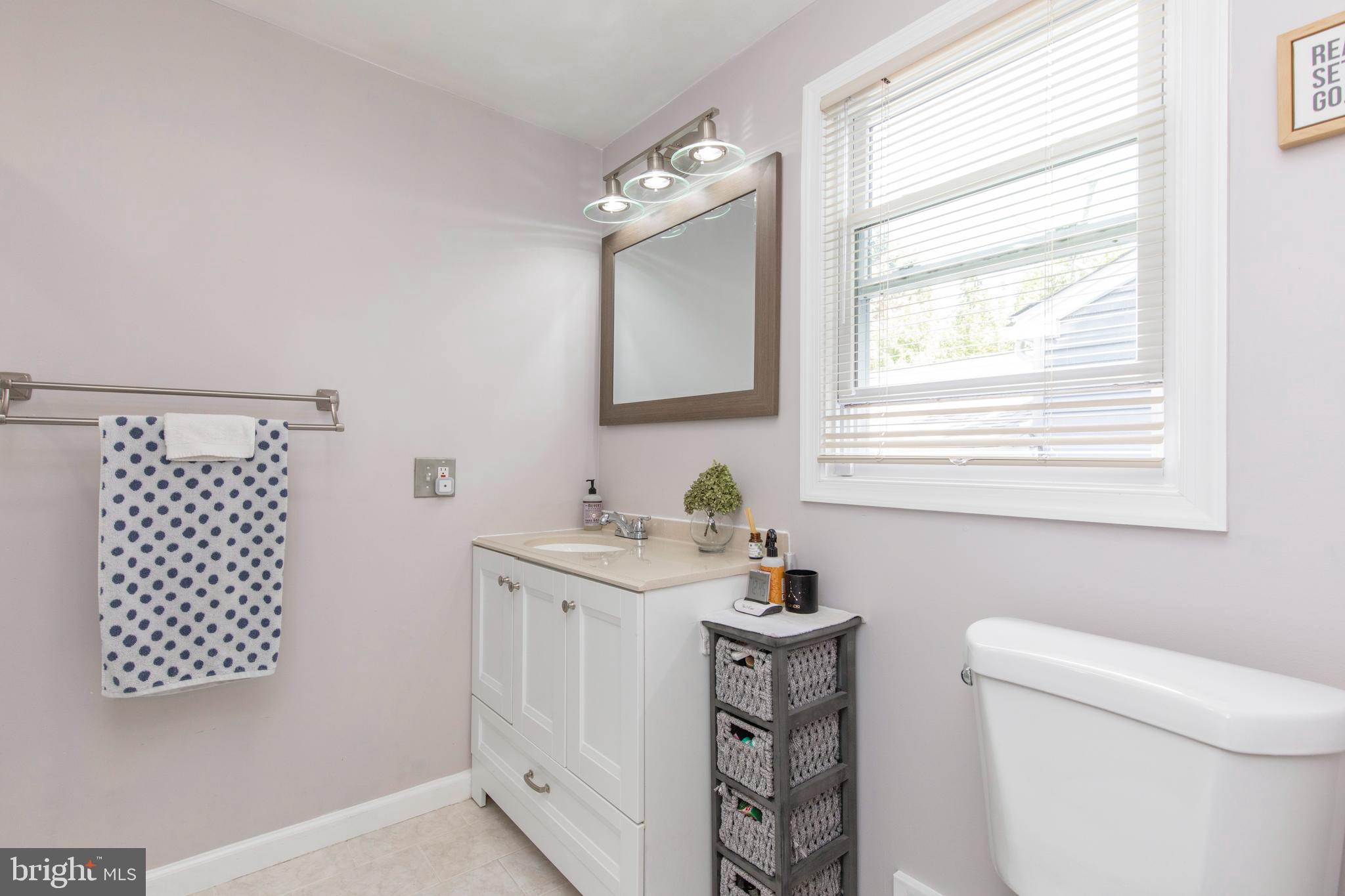 209 Glendale Road Havertown, PA 19083 - Photo 19 of 38 a bathroom with a sink a toilet and a window