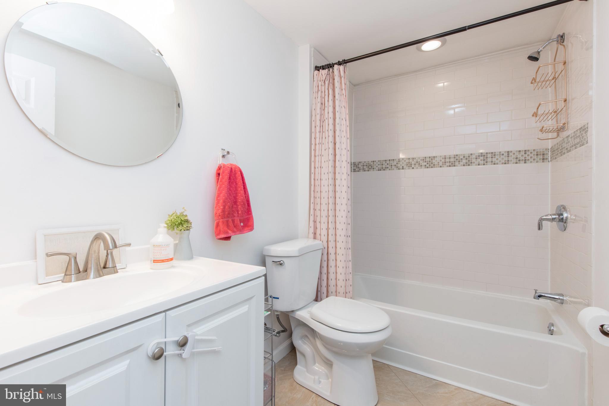 209 Glendale Road Havertown, PA 19083 - Photo 23 of 38 a bathroom with a sink mirror vanity and toilet