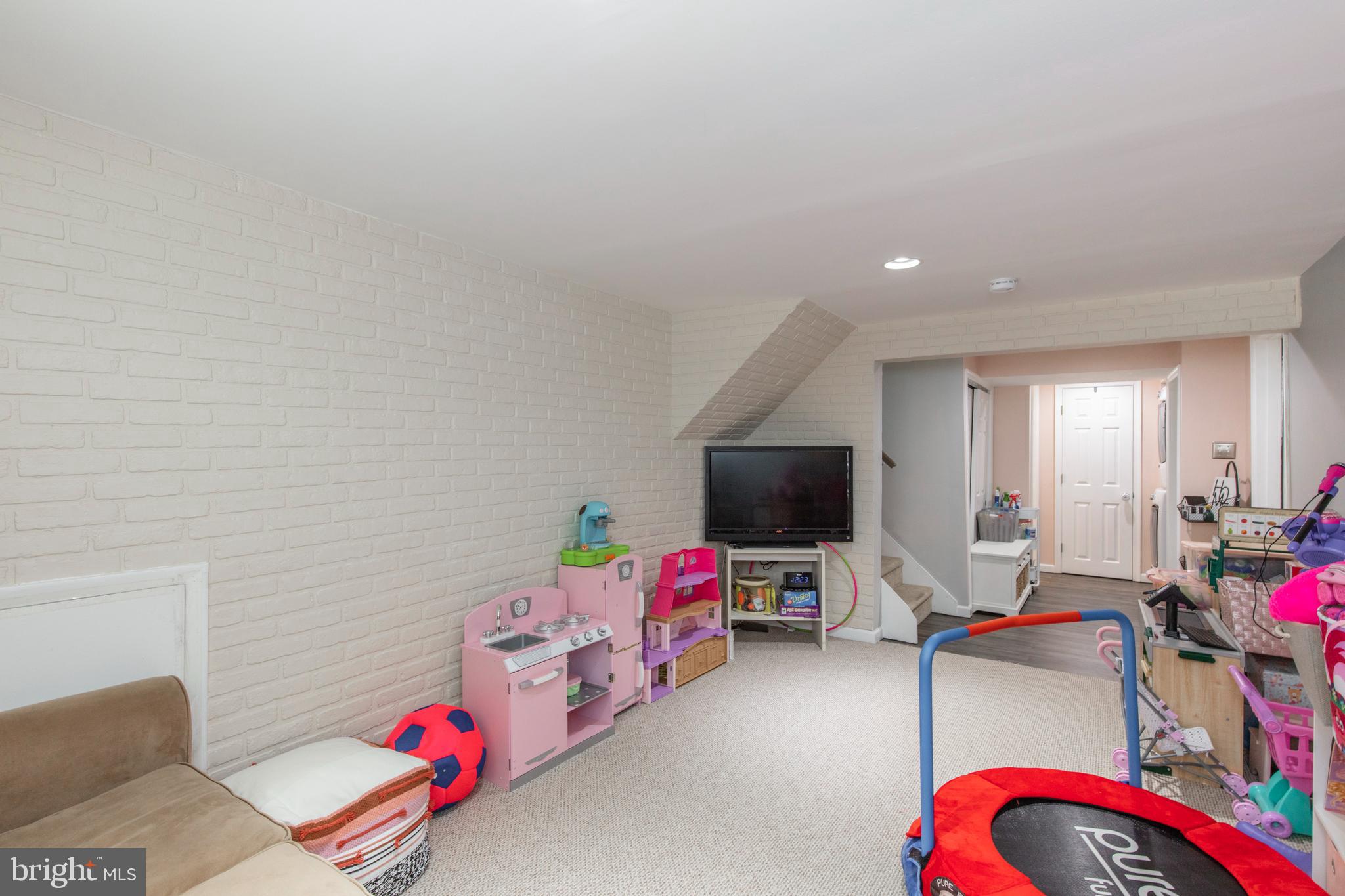 209 Glendale Road Havertown, PA 19083 - Photo 27 of 38 a living room with furniture and a flat screen tv