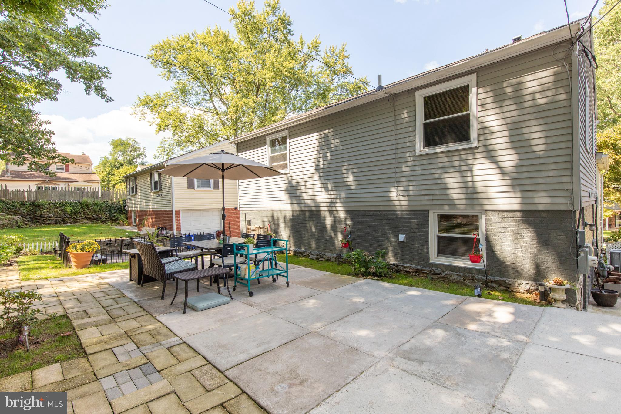 209 Glendale Road Havertown, PA 19083 - Photo 35 of 38 a view of a house with patio and a yard