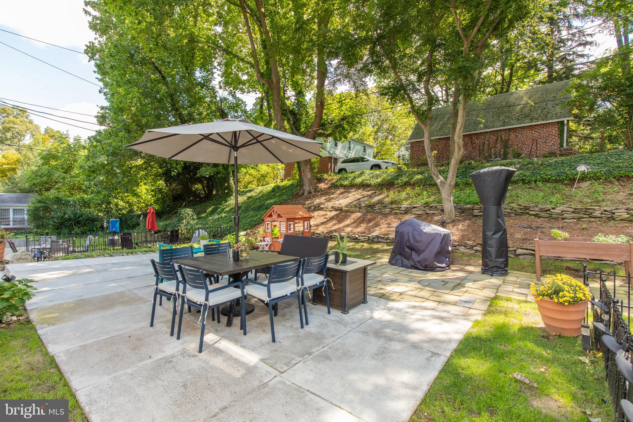 209 Glendale Road Havertown, PA 19083 - Photo 37 of 38 a view of a patio with table and chairs under an umbrella