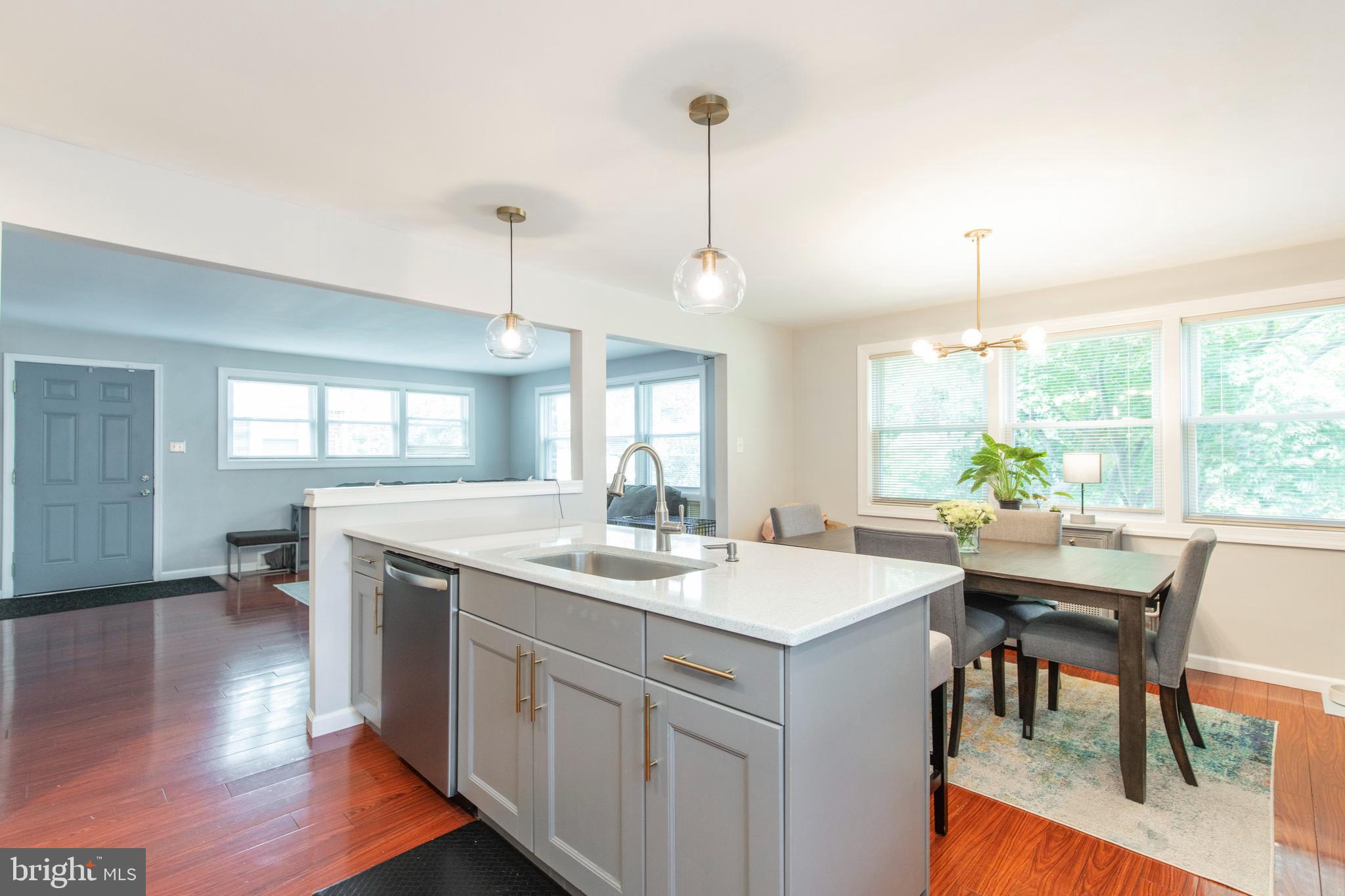 209 Glendale Road Havertown, PA 19083 - Photo 9 of 38 a kitchen with a table chairs and wooden floor