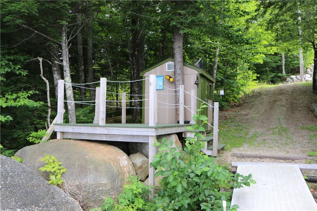 326 Patten Pond Road Surry, ME 04684 - Photo 4 of 35 View from dock showing deck and...