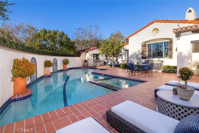 swimming pool view with a outdoor seating