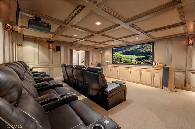 a media room with lots of chairs and a projector