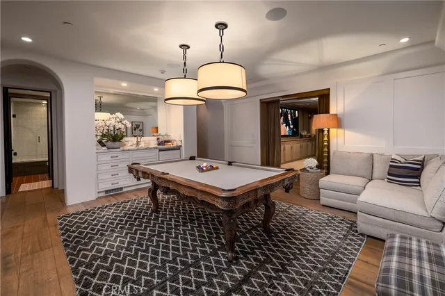 a living room with a table and chairs