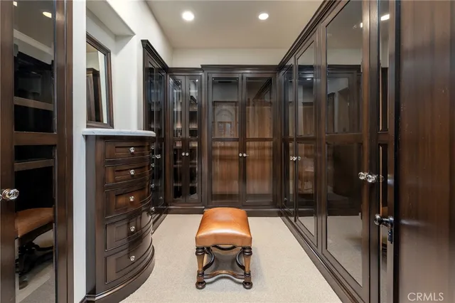 a bathroom with double vanity and a shower