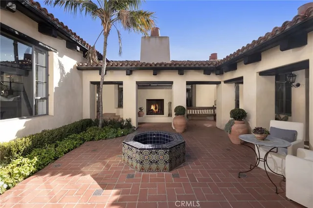 a living room with a couch and a potted plant