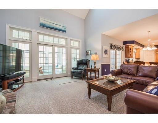 60 Eben Chamberlain Road Northbridge, MA 01588 - Photo 11 of 29 a living room with furniture a flat screen tv and a window