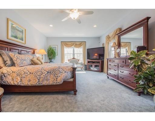 60 Eben Chamberlain Road Northbridge, MA 01588 - Photo 17 of 29 a bedroom with a large bed and a large window