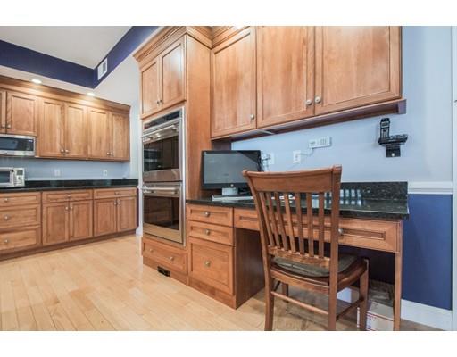 60 Eben Chamberlain Road Northbridge, MA 01588 - Photo 3 of 29 a kitchen with stainless steel appliances kitchen island granite countertop a stove a sink and a microwave