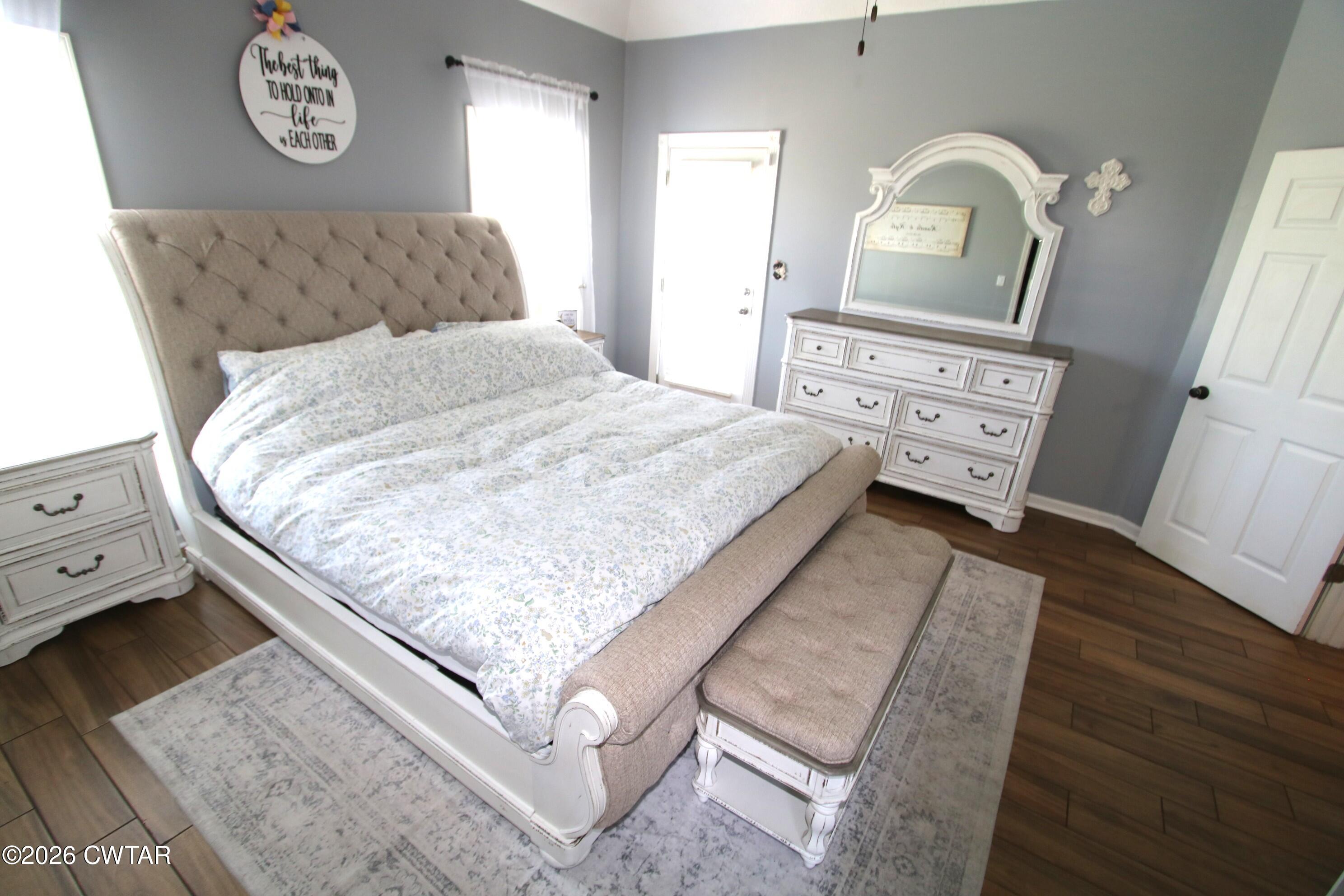 98 Browning Road Milan, TN 38358 - Photo 20 of 59 a bedroom with a bed and a dresser