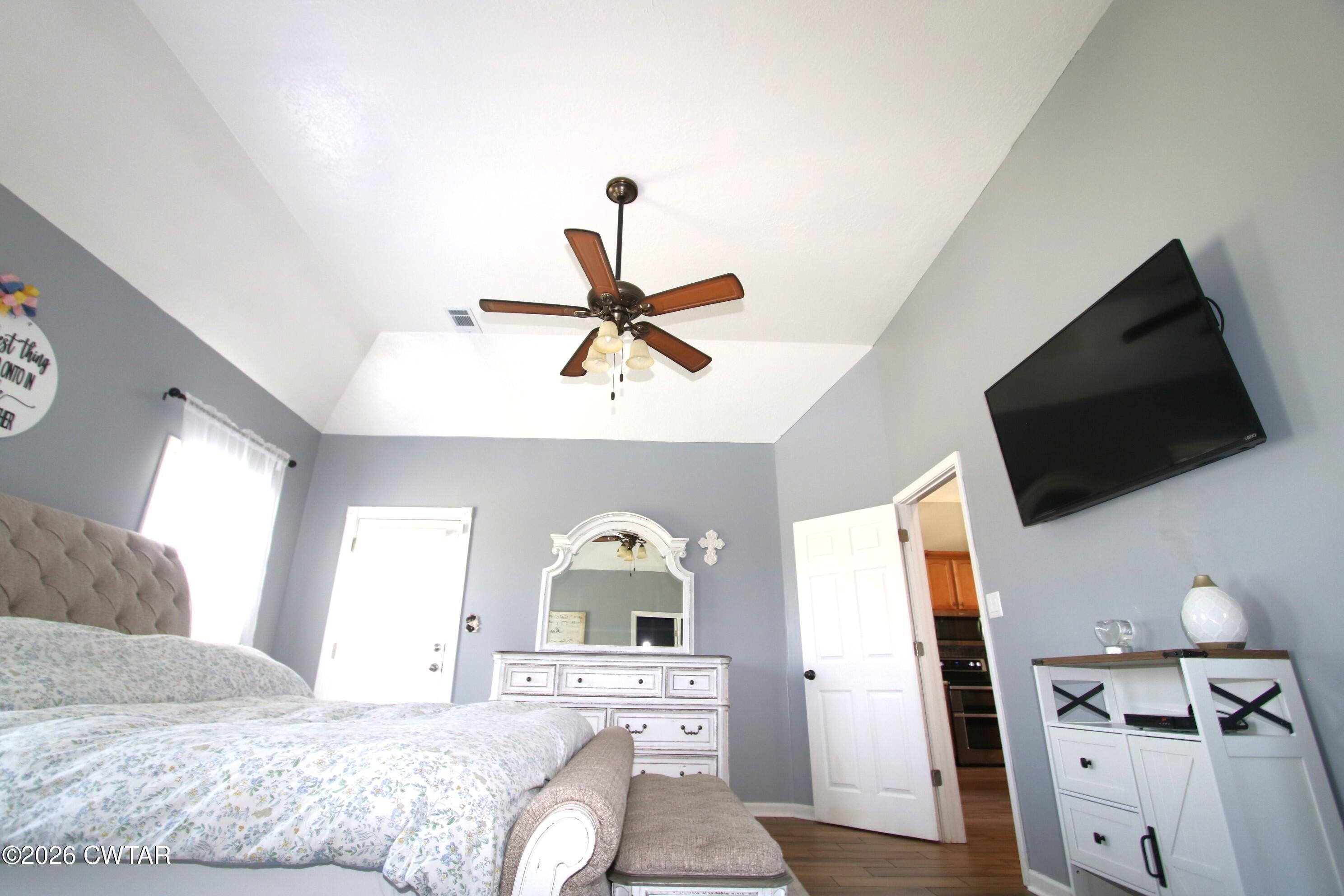 98 Browning Road Milan, TN 38358 - Photo 21 of 59 a bedroom with a bed and a flat screen tv