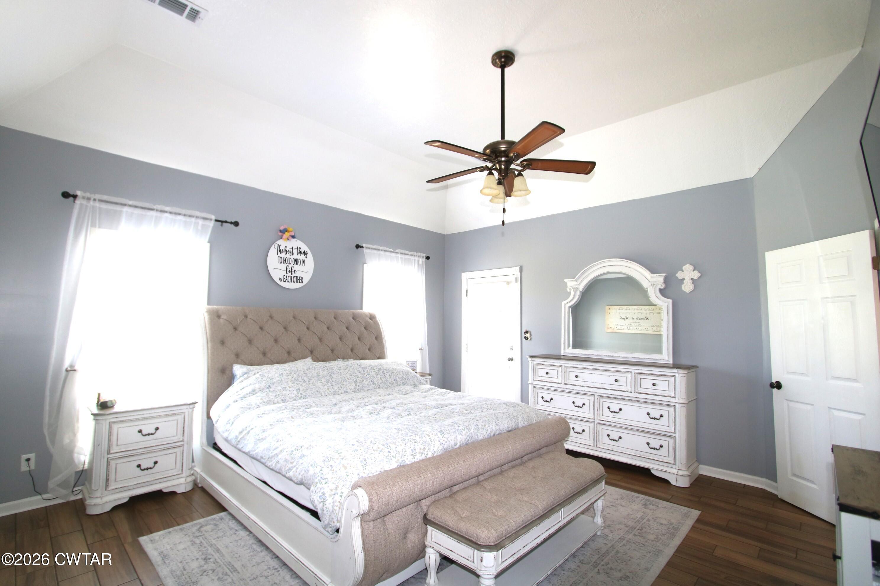 98 Browning Road Milan, TN 38358 - Photo 22 of 59 a bedroom with a bed and a dresser
