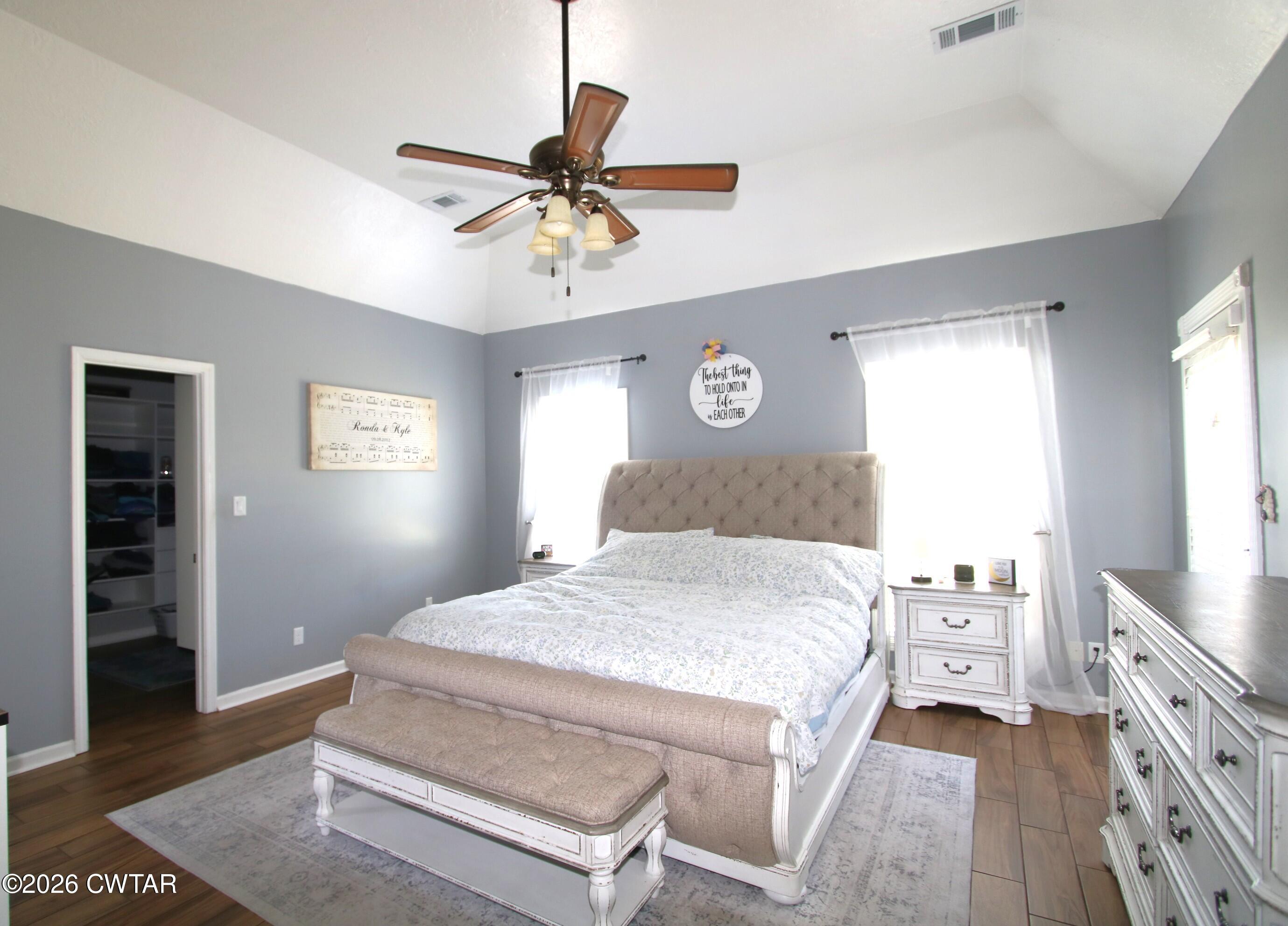 98 Browning Road Milan, TN 38358 - Photo 23 of 59 a bedroom with a bed and a chandelier