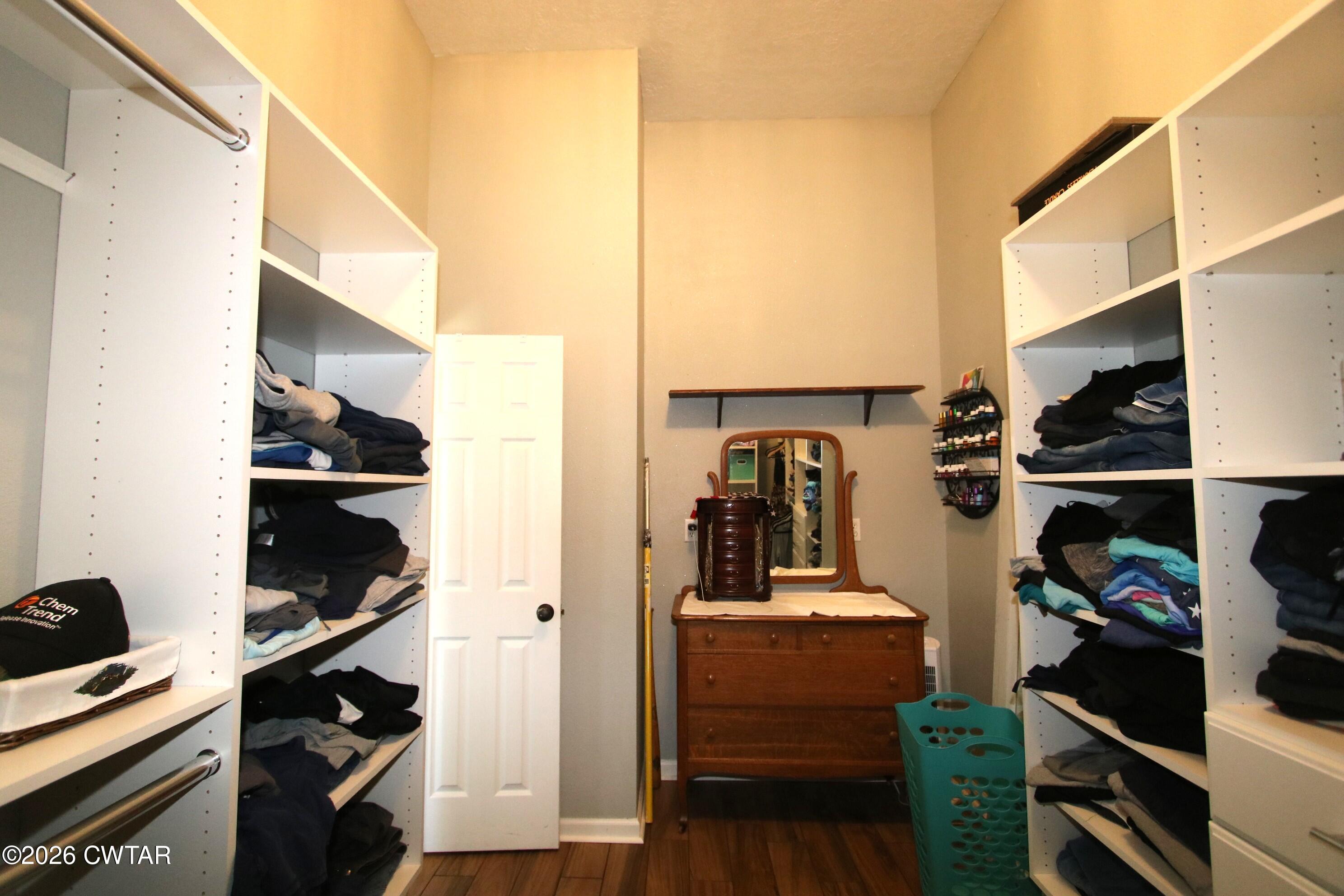 98 Browning Road Milan, TN 38358 - Photo 25 of 59 a view of walk in closet with clothes and shoes