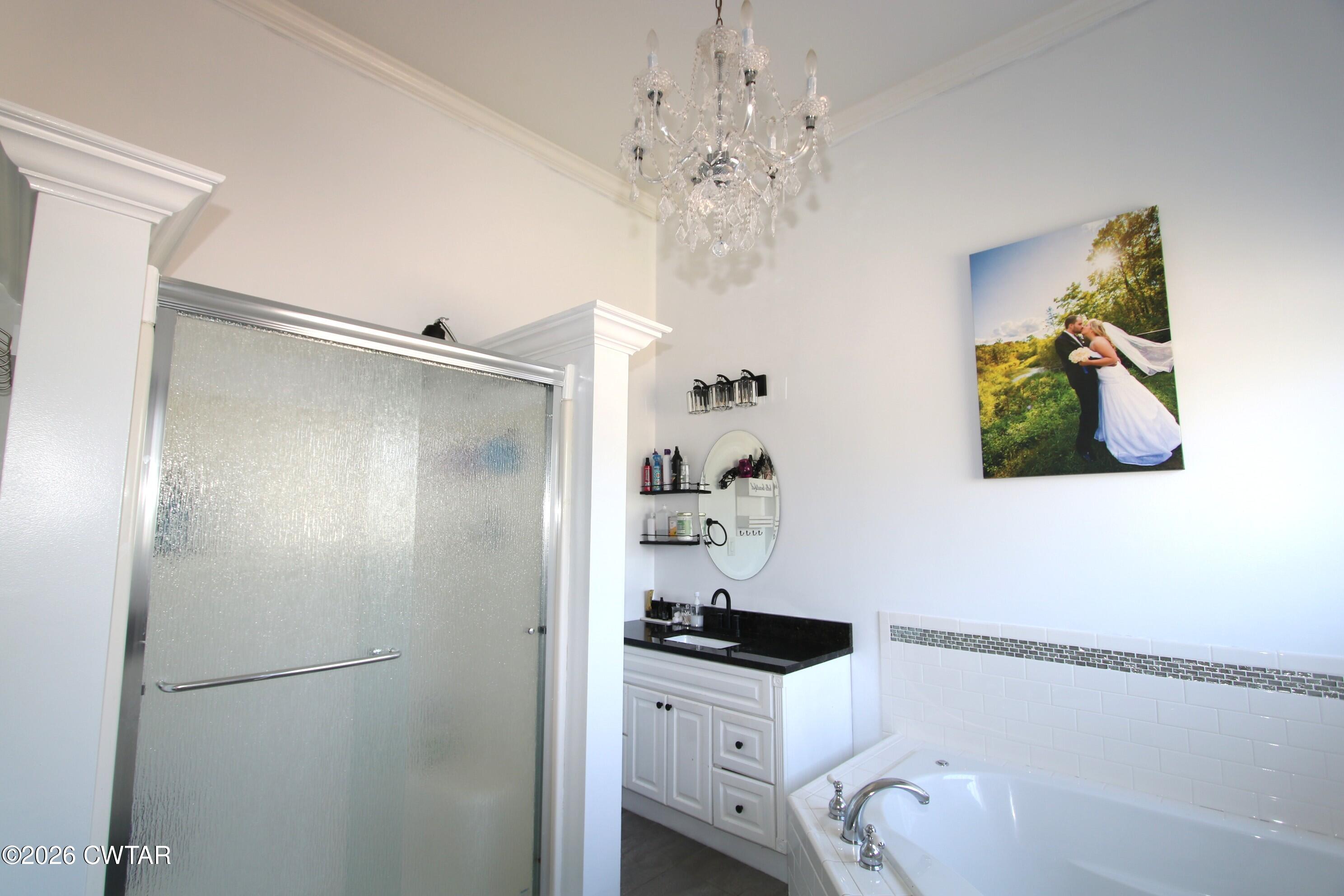 98 Browning Road Milan, TN 38358 - Photo 28 of 59 a bathroom with a sink a mirror and a shower