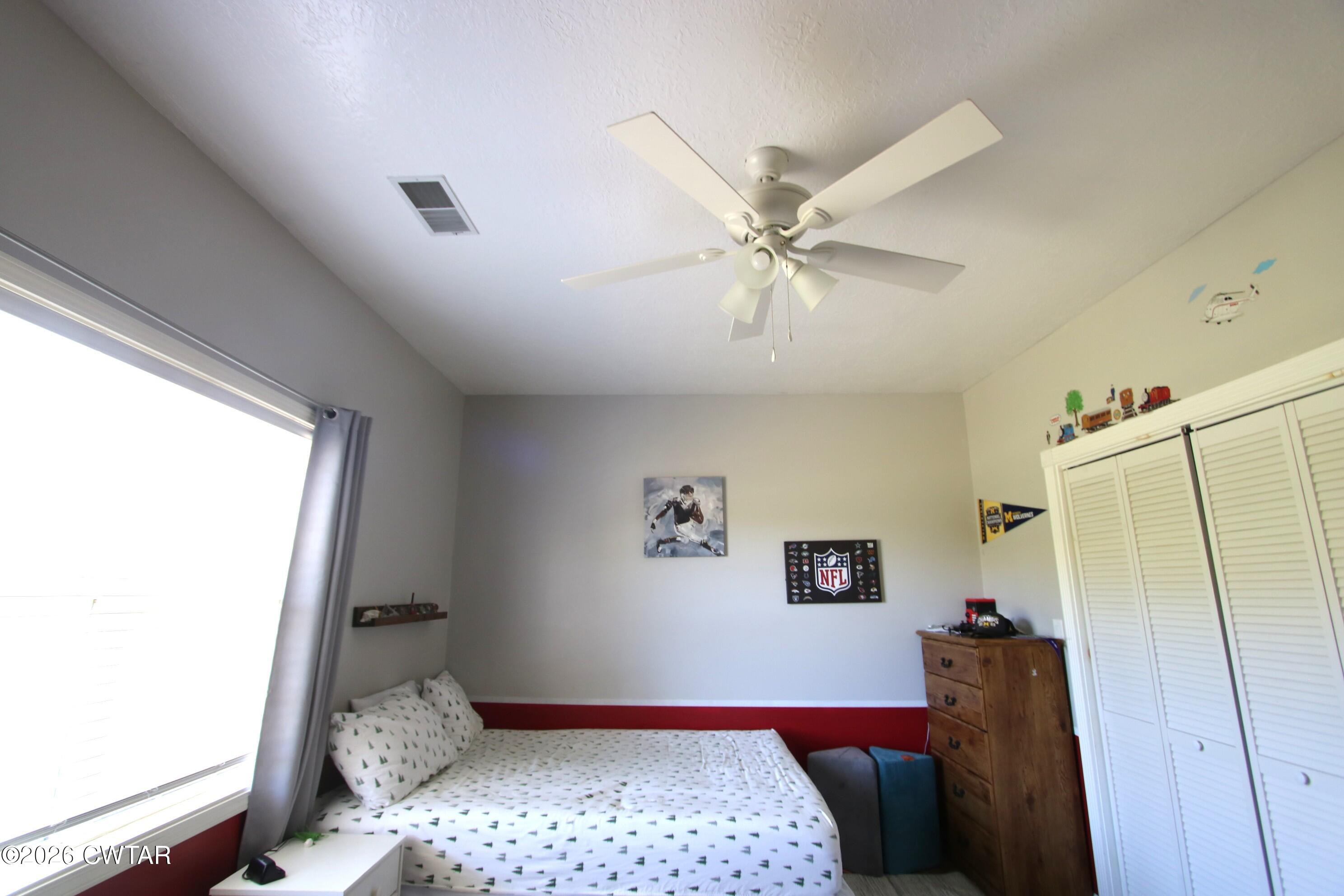 98 Browning Road Milan, TN 38358 - Photo 35 of 59 a bedroom with a bed and a couch