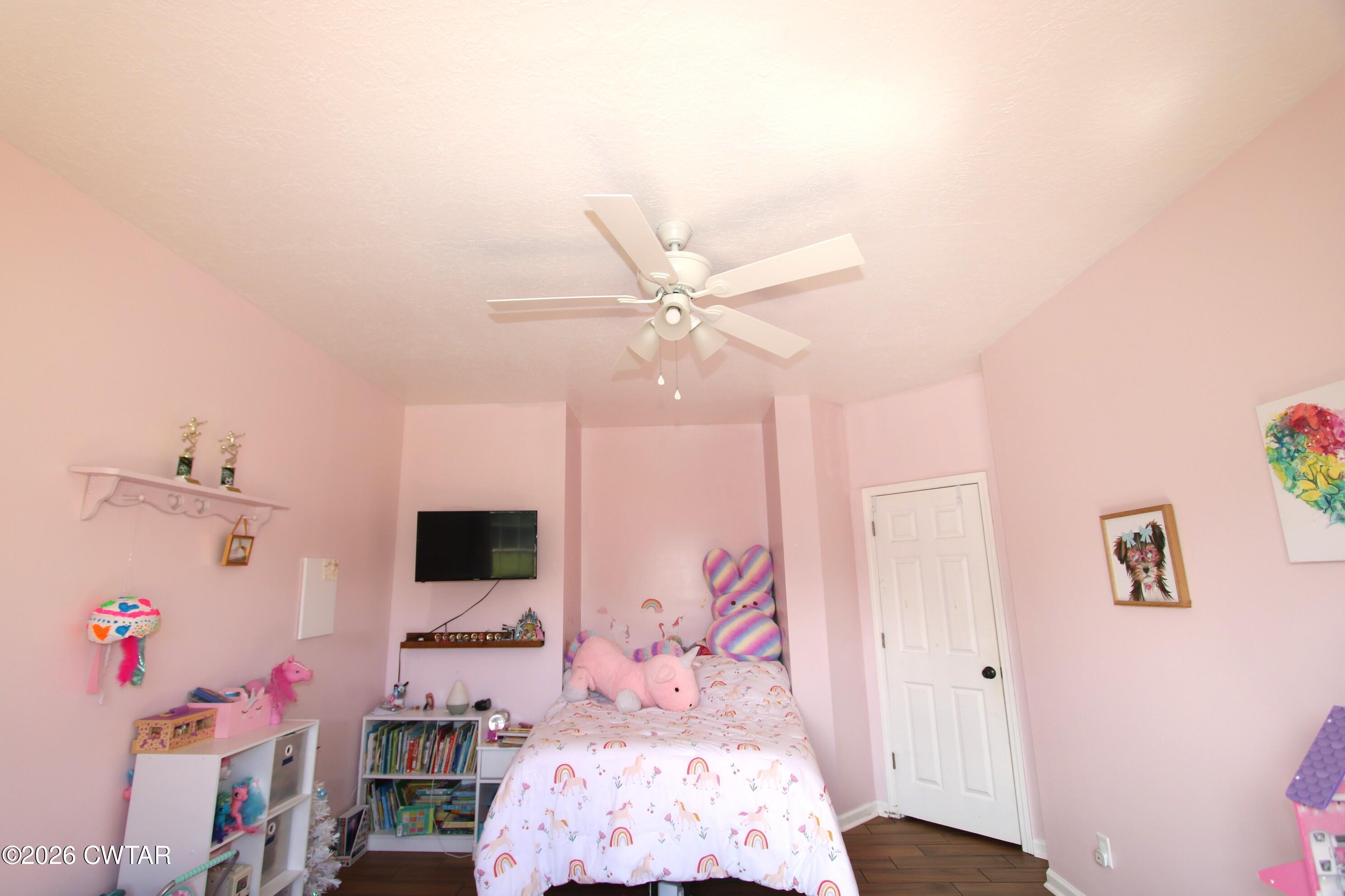 98 Browning Road Milan, TN 38358 - Photo 40 of 59 a bedroom with a bed and a window