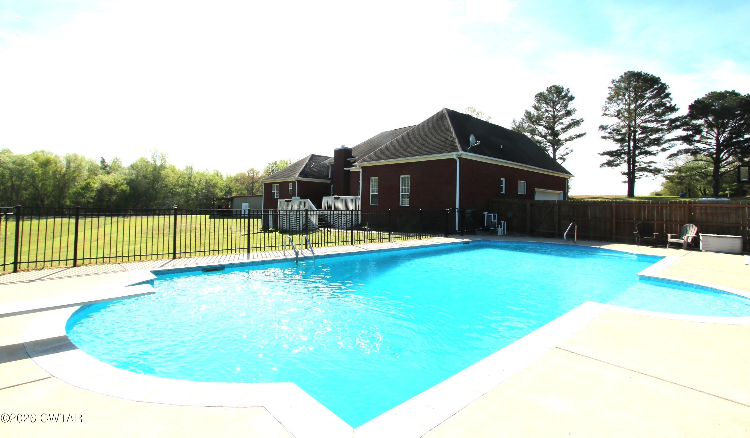 98 Browning Road Milan, TN 38358 - Photo 4 of 59 a view of a house with a yard