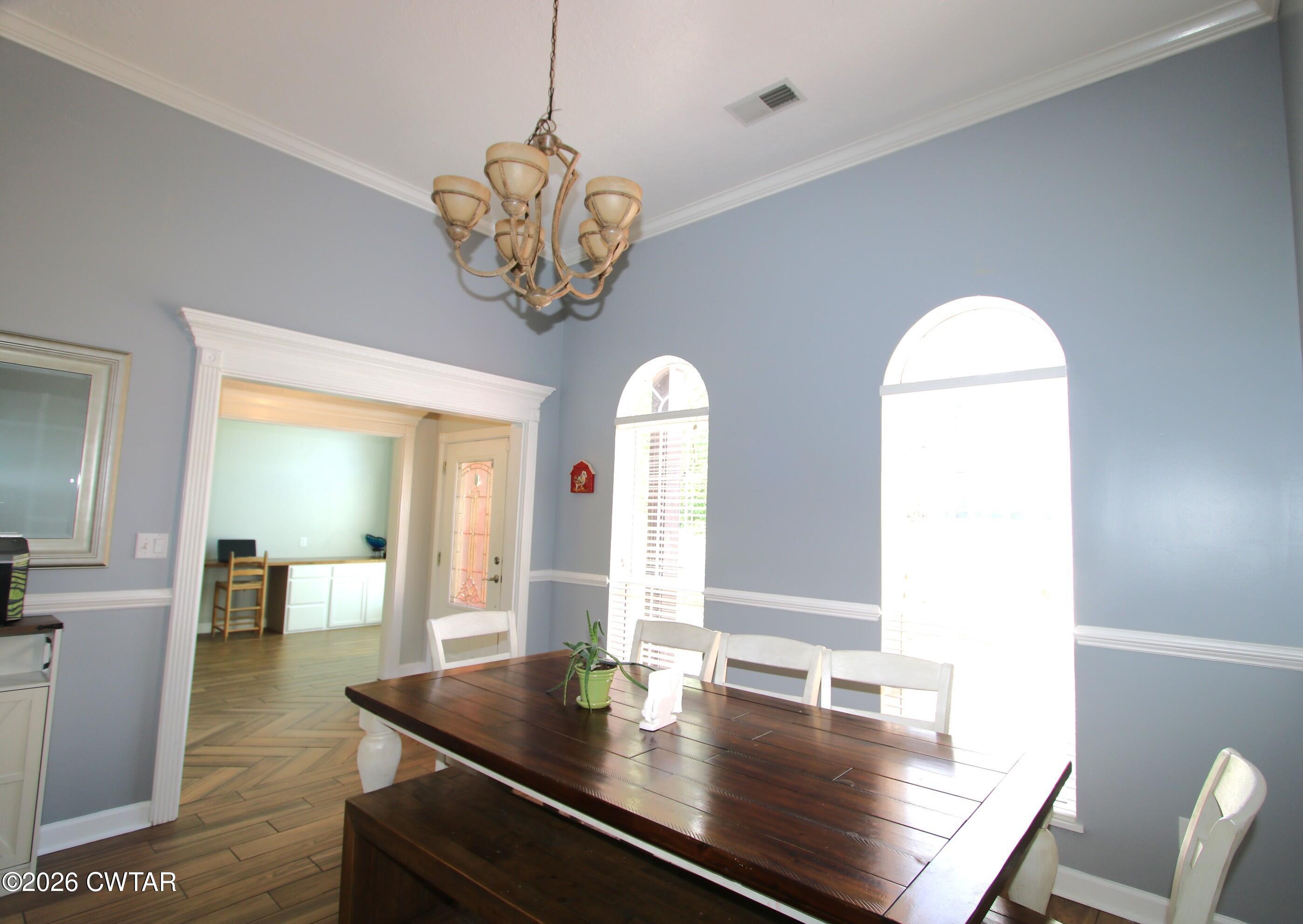 98 Browning Road Milan, TN 38358 - Photo 8 of 59 a view of dining room and kitchen countertops with wooden floor