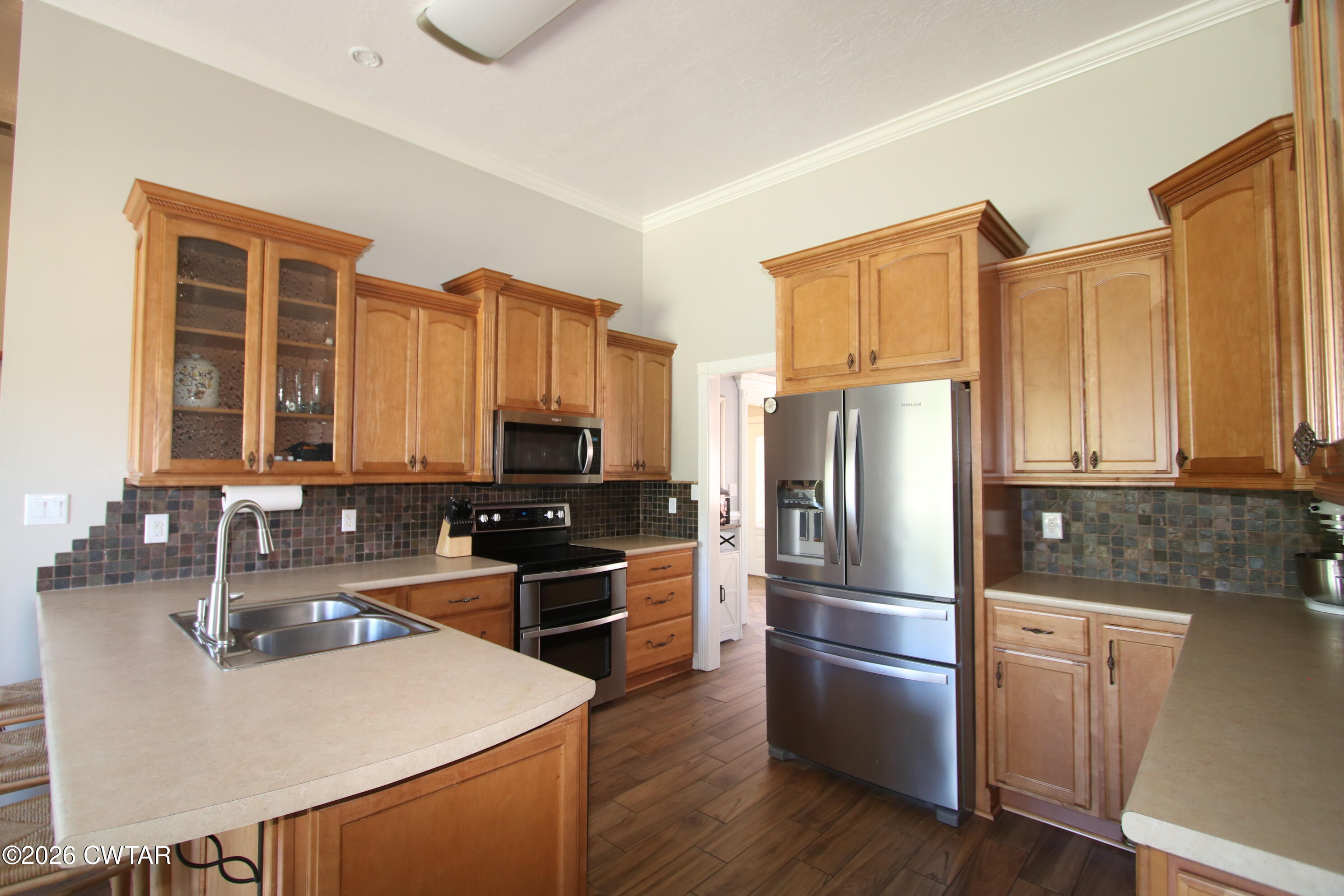 98 Browning Road Milan, TN 38358 - Photo 9 of 59 a kitchen with granite countertop a refrigerator stove and sink
