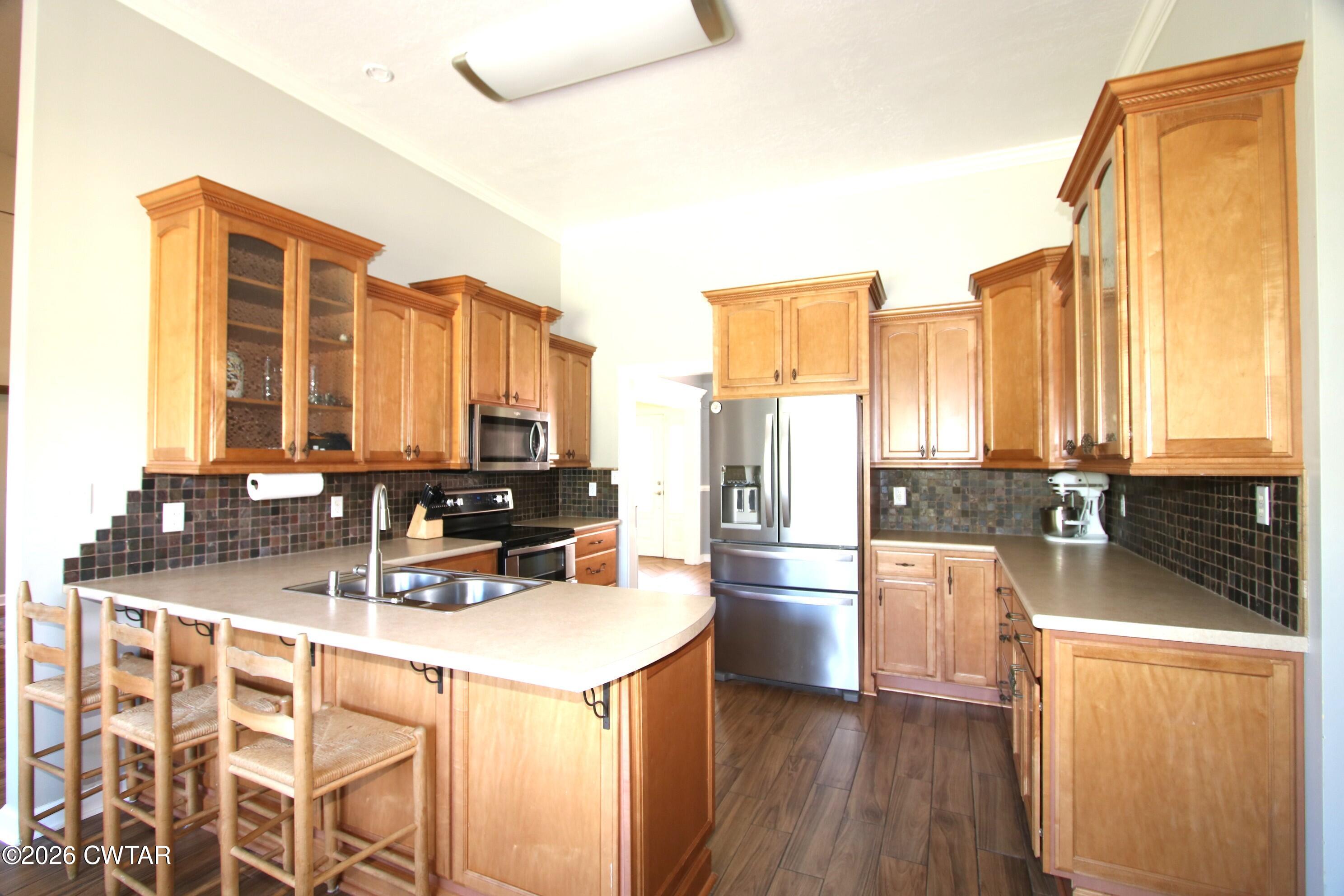 98 Browning Road Milan, TN 38358 - Photo 10 of 59 a kitchen with appliances a sink and cabinets
