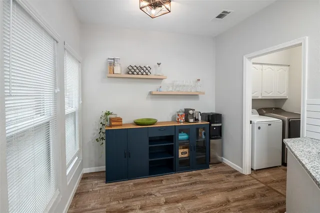 a room with cabinets and wooden floor
