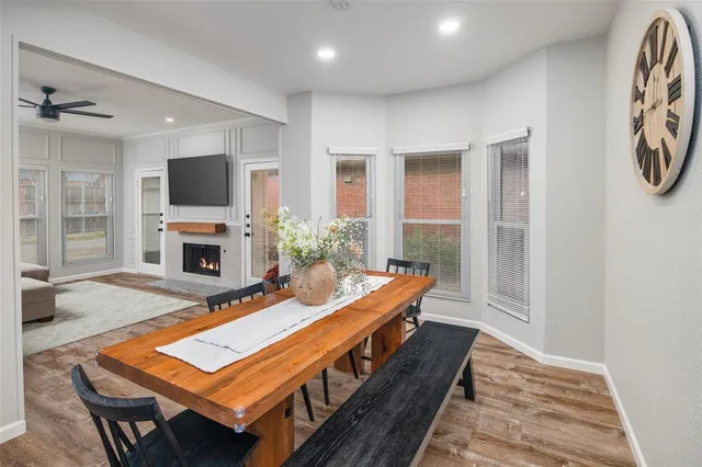 a room with furniture a flat screen tv and a fireplace