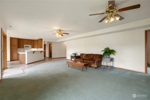 a bed room with furniture and kitchen view