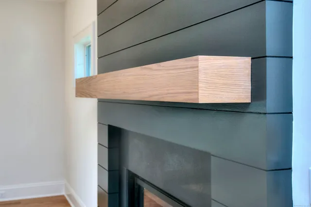 a view of hallway with stairs and wooden floor