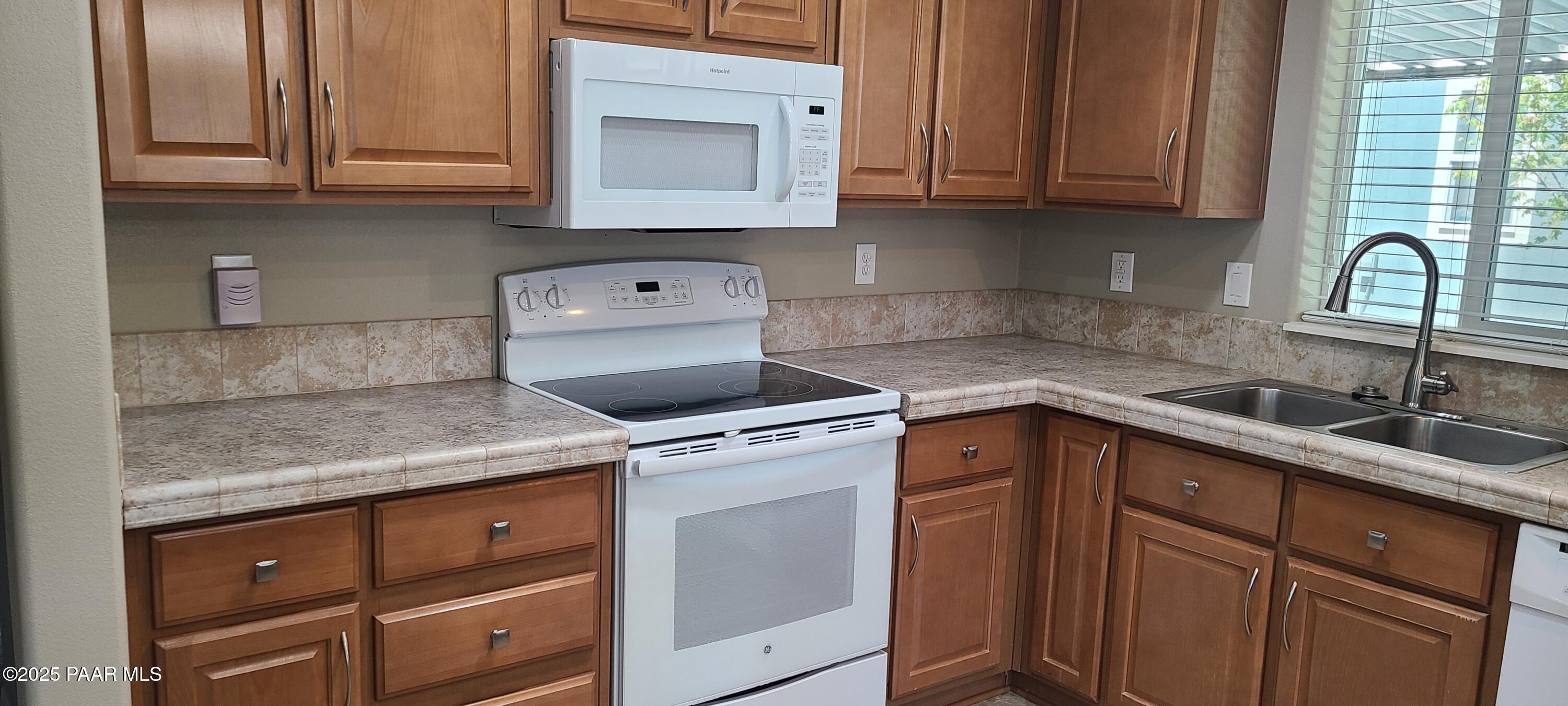 2146 Jackrabbit Drive, Unit 2146 Dewey, AZ 86327 - Photo 11 of 48 a kitchen with a sink cabinets and appliances