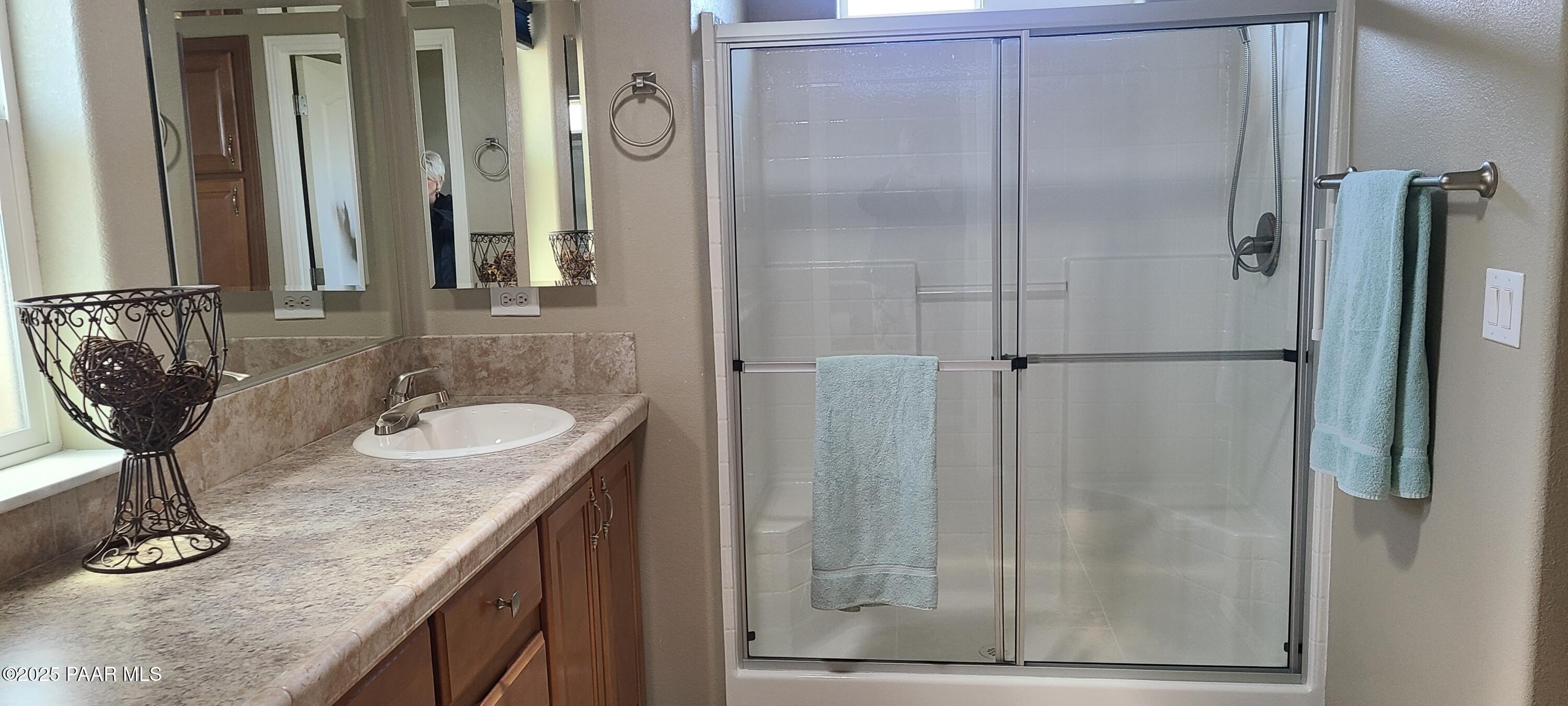 2146 Jackrabbit Drive, Unit 2146 Dewey, AZ 86327 - Photo 29 of 48 a bathroom with a granite countertop sink and a mirror