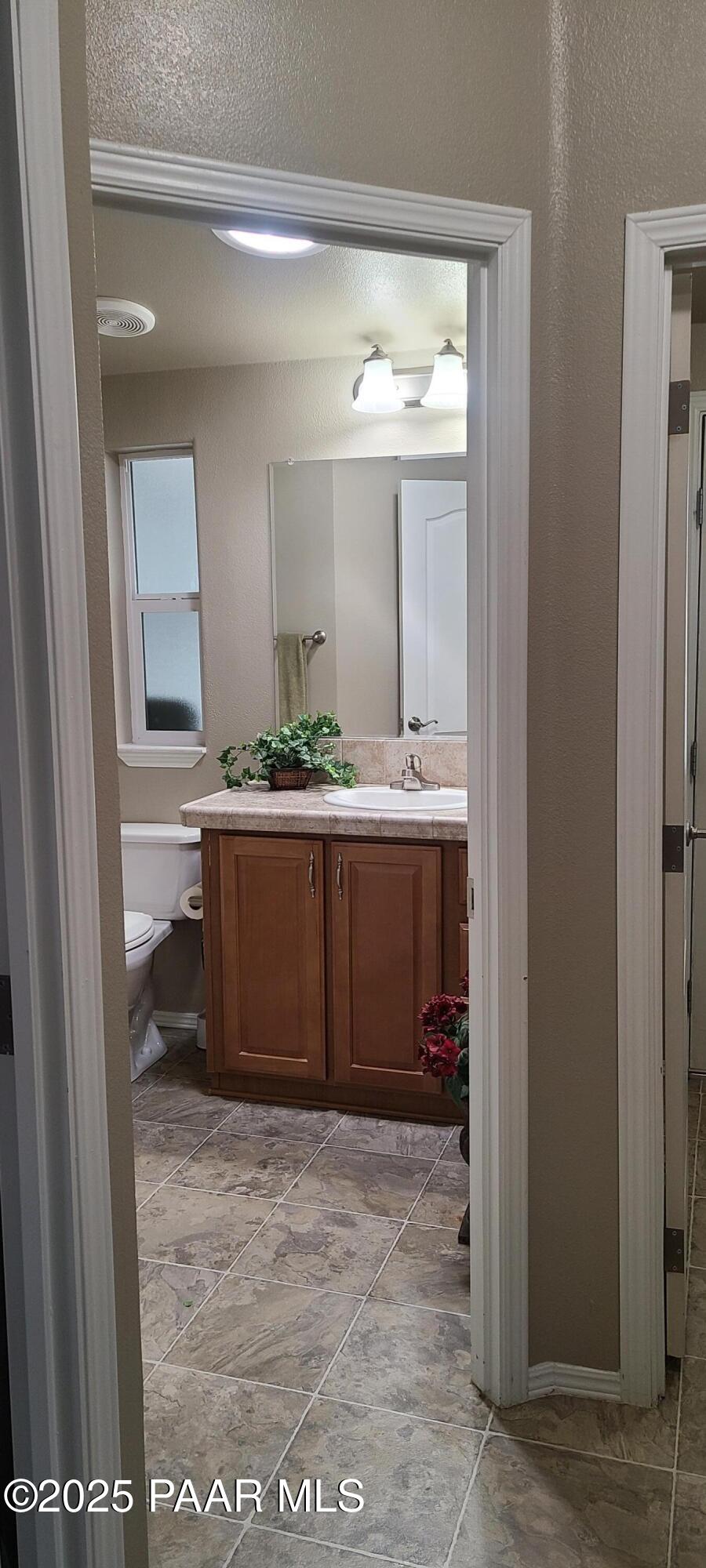 2146 Jackrabbit Drive, Unit 2146 Dewey, AZ 86327 - Photo 33 of 48 a bathroom with a sink and a mirror