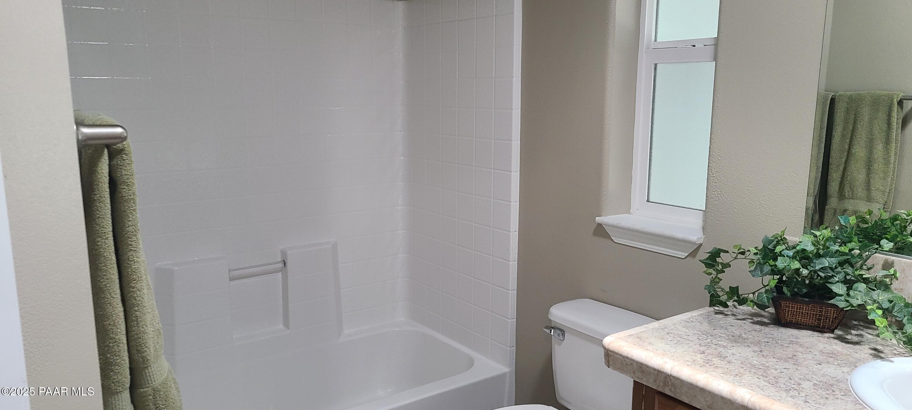 2146 Jackrabbit Drive, Unit 2146 Dewey, AZ 86327 - Photo 35 of 48 a bath room with a sink and a mirror